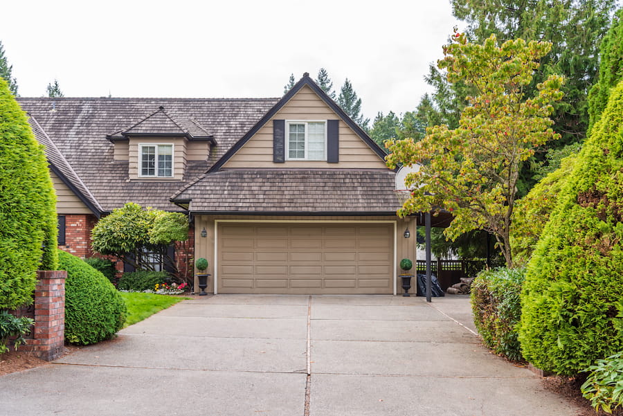 Modern home with a newly installed asphalt shingle roof and enhanced curb appeal