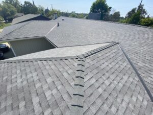 Newly installed asphalt shingle roof on a residential home following professional roof replacement